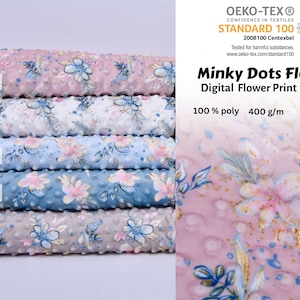 May include: Five fabric swatches of Minky Dots Fleece in different colours: Old Rose, Ecru, Baby Blue, Dusty Blue, and Taupe. The fabric has a small dot texture and a floral print. The fabric is 100% polyester, 400 grams per square metre, and 150 centimetres wide. The fabric is certified by OEKO-TEX Standard 100.