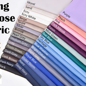 May include: A selection of viscose lining fabric swatches in a range of colours, including purple, peach, pink, dark mauve, raisin, mint green, teal blue, sky blue, heritage, blue shadow, bright cobalt, light grey, royal blue, violet storm, navy, dark navy, deep navy, dark brown, dark grey, rosin green, grey, medium grey, pearl grey, bronze, silver, taupe, beige, ecru white, ecru, sand, and morel.