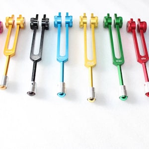 8 pc chakra tuning fork set with mallet activator and pouch for sound healing kit for use meditation relaxation chakra stone