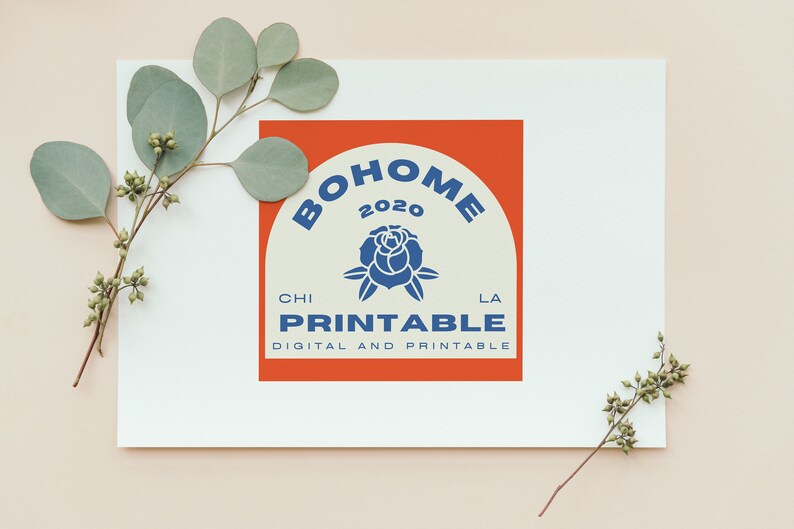 May include: A white card with a red and white logo that says "BOHOME 2020" in a blue arch with a blue rose in the centre. The text "CHI PRINTABLE LA" is below the arch and the text "DIGITAL AND PRINTABLE" is below that.
