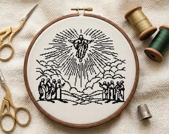 May include: A black and white cross-stitch embroidery of a religious scene, set in a wooden hoop. The design depicts a figure ascending with radiating light, above a group of figures. Gold scissors, thread spools, and a thimble are also visible.