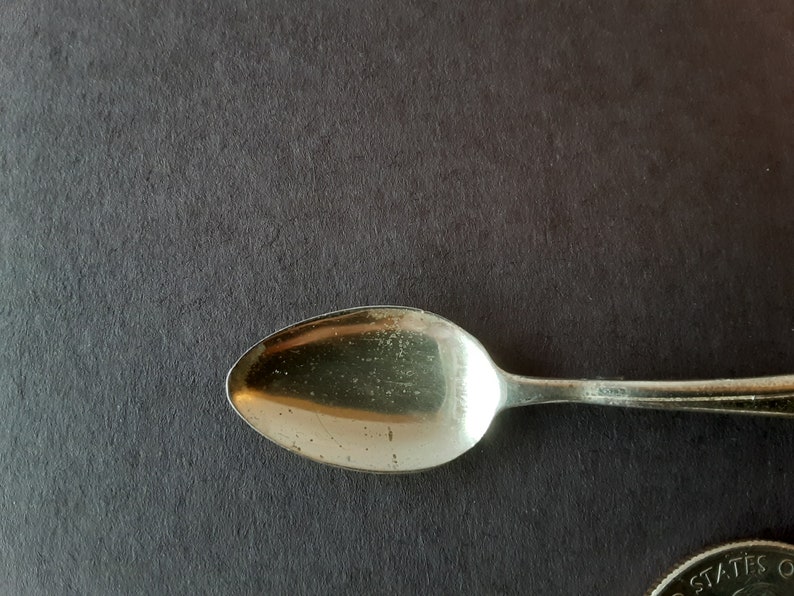 Silver spoon pin