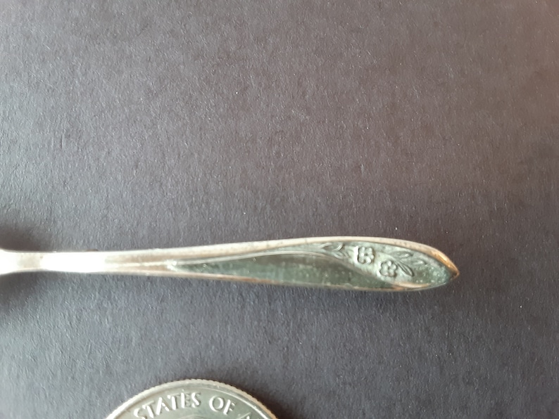 Silver spoon pin