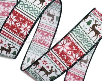 May include: A decorative ribbon with a Christmas theme. The ribbon features a repeating pattern of snowflakes, reindeer, and geometric designs in red, green, and brown on a white background. The edges are trimmed with a dark green border.