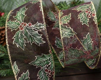 May include: A decorative ribbon with a dark brown background and a repeating pattern of green holly leaves and red berries. The ribbon's edges are trimmed with gold. This festive ribbon is suitable for holiday decorations.
