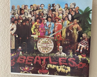 Beatles Record Cover Clock (Sgt. Pepper's Lonely Hearts Club Band) - 12” wall clock made with the actual album cover. Includes song lyrics!