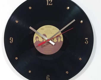 The Beatles Vinyl Record Clock (Love Songs) 12” wall clock created using the actual Beatles record.