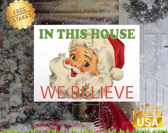 In this House We Believe "Santa" Edition - Corrugated Yard Sign with H-Stake for display.