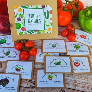 May include: A collection of seed packets for "Todd's Garden" with various vegetable illustrations. The packets are arranged with fresh produce like tomatoes, peppers, and onions. The packets include information on sowing depth, spacing, and plant height.
