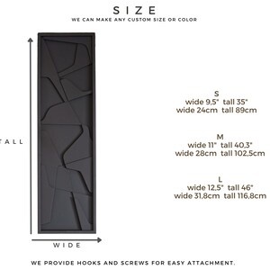 May include: A black wooden wall art piece with a geometric design. The art piece is available in three sizes: small (9.5 inches wide by 35 inches tall), medium (11 inches wide by 40.3 inches tall), and large (12.5 inches wide by 46 inches tall).