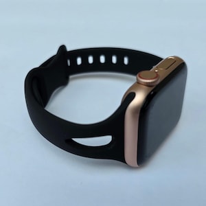 Soft Silicone Wristband Narrow Watch Band for Apple Watch 10, 9, 8, 7, 6, 5, 4, 3, 2, 1, and SE for all models. The color is "Black."
