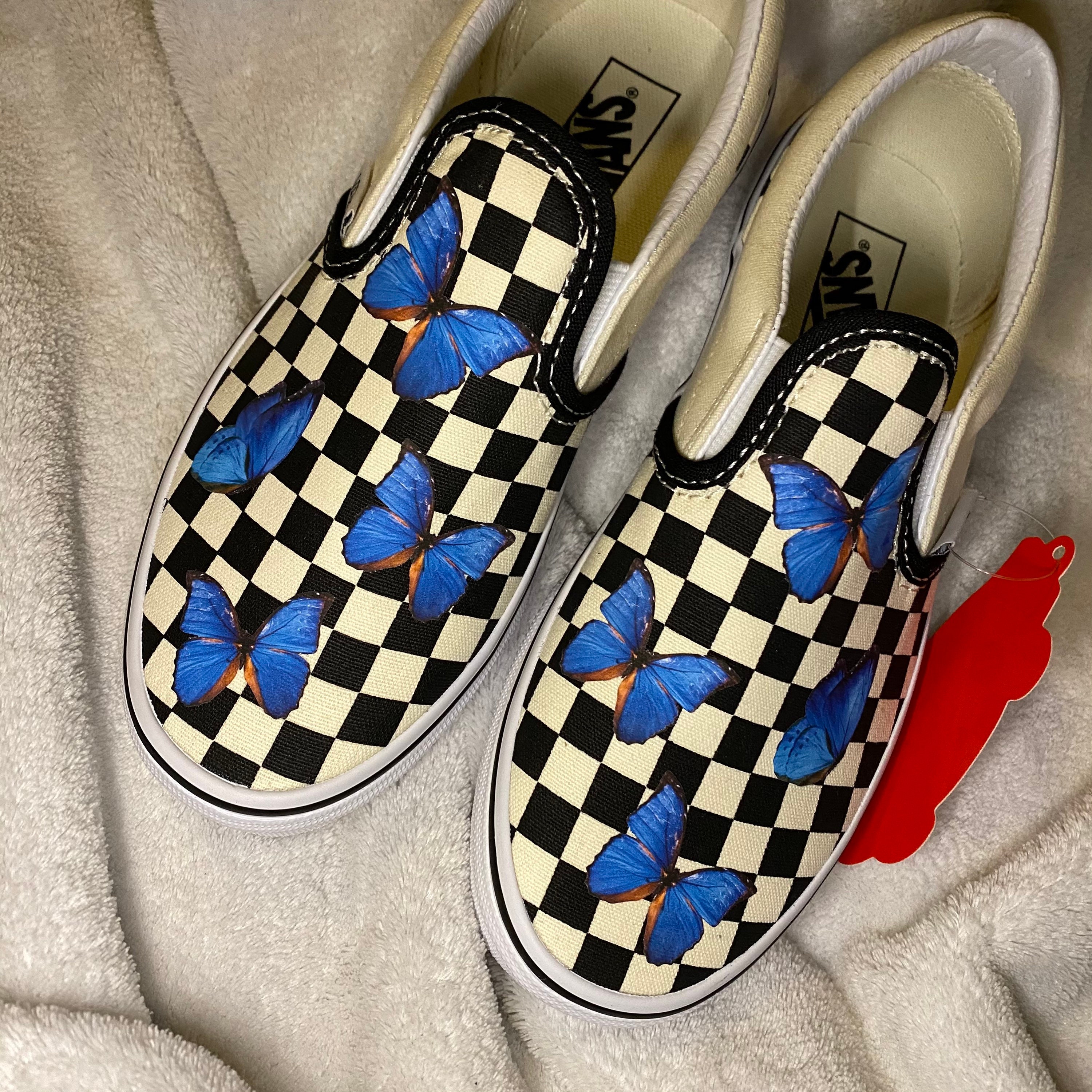 white shoes with blue butterflies