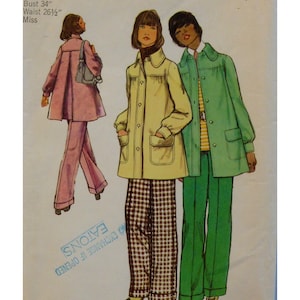 May include: A sewing pattern envelope featuring illustrations of three outfits: a pink jacket and pants, a yellow jacket with brown houndstooth pants, and a green jacket with green pants. Text includes Bust 34", Waist 26 1/2", Miss, and EATON'S.