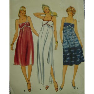 May include: A sewing pattern for a sleeveless maxi dress with a fitted bodice and a flowing skirt. The pattern includes three variations: a red dress, a white dress with a side slit, and a blue and white patterned dress.