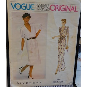 May include: Vintage Vogue Paris Original sewing pattern featuring two dress designs. The pattern includes illustrations of the dresses, one a white button-down dress and the other a floral print dress. The brand Givenchy is visible at the bottom.