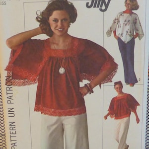 May include: A vintage sewing pattern from Jiffy featuring a red top with lace trim and wide sleeves, paired with white pants. The pattern includes multiple views of the top. The size is 16-18.