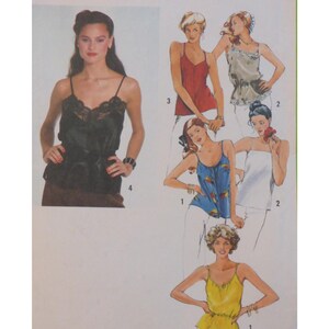 May include: A fashion illustration featuring several camisole tops in different colours and designs. One model is wearing a black camisole with lace detailing. Other tops are red, blue, white, and yellow. The image is a vintage fashion illustration.