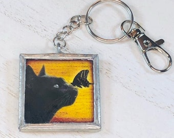 Handmade Glass and Silver Soldered Reversible Keychain - Lead Free Pewter Finish - Black Cat with Butterfly
