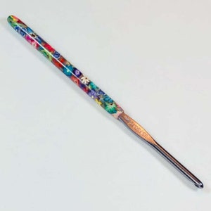 May include: A colorful crochet hook with a floral design and a silver metal hook. The hook is labeled "US Size H-8 (5.0 mm)".