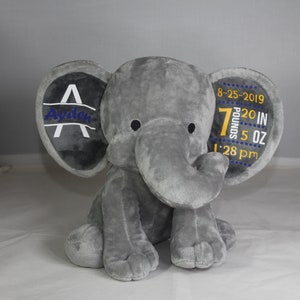 May include: Grey plush elephant with embroidered ears. One ear says "Ayden" and the other ear says "8-25-2019 7 pounds 20 in 5 oz 1:28 pm".