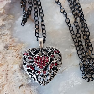 May include: A set of three ceramic mugs with a speckled, matte finish in cream, light grey, and dark grey. Each mug has a simple, minimalist design and a rounded handle.