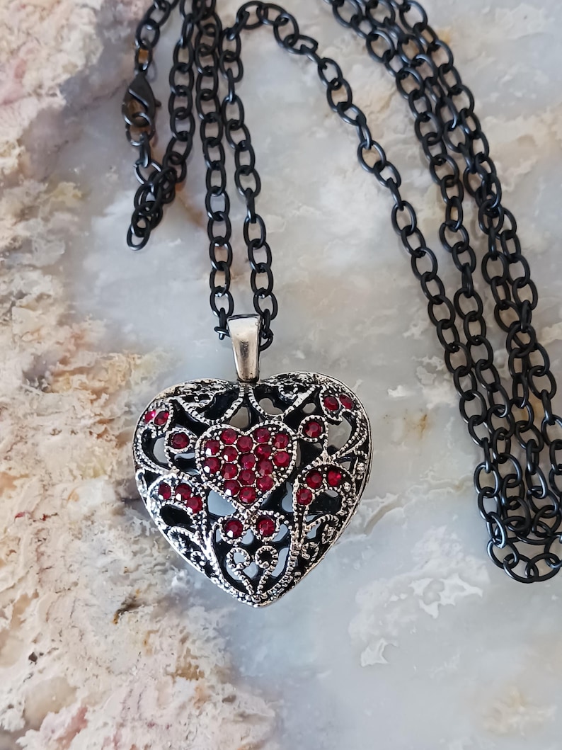 May include: A set of three ceramic mugs with a speckled, matte finish in cream, light grey, and dark grey. Each mug has a simple, minimalist design and a rounded handle.