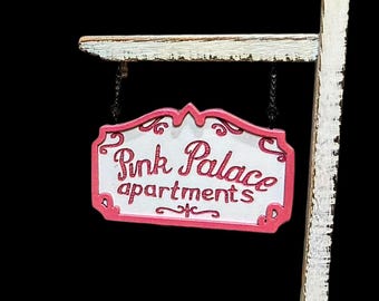 Desk size Pink Palace sign with stand. Handmade and hand painted. Perfect for the Button eye girl fan!