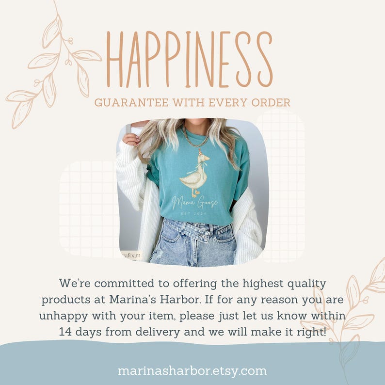 May include: A teal blue t-shirt with a white graphic of a goose with the text "Mama Goose" and "Est. 2020". The t-shirt is being worn by a person with a white cardigan and blue jeans. The text "Happiness Guarantee with Every Order" is at the top of the image.