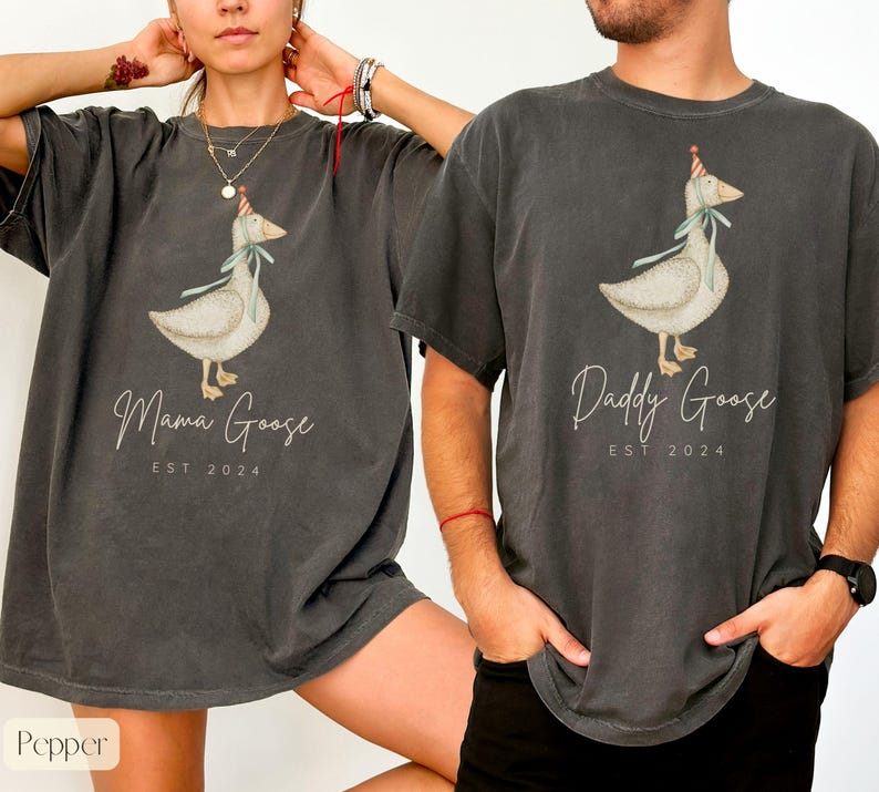 May include: Two gray t-shirts with a goose wearing a party hat and the text "Mama Goose Est 2024" and "Daddy Goose Est 2024".