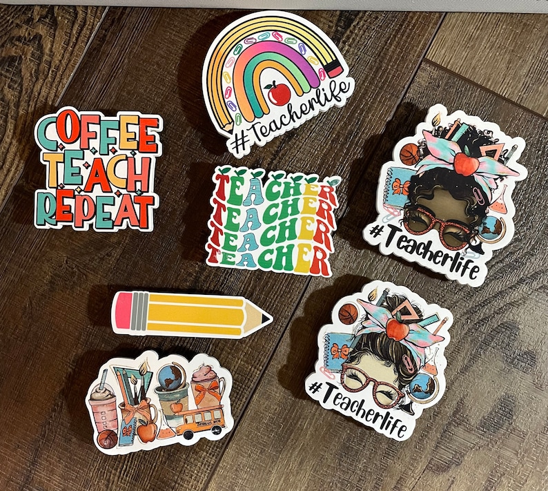 May include: A set of colorful teacher-themed stickers. The stickers feature a rainbow, a pencil, a coffee cup, a teacher with glasses, and the text "Coffee Teach Repeat" and "#Teacherlife".