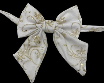 Holiday shimmer, pet sailors bow tie, white with glittery gold detail.
