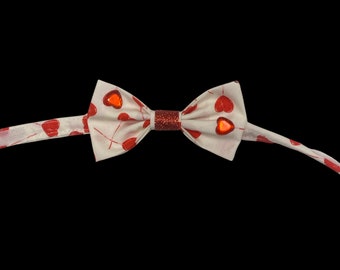 Lovely Lollipops, pet bow tie, white with red heart shaped lollipops. With red heart gem details and red sparkly center.
