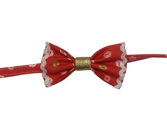 Valentine’s Kisses, pet bow tie, red with pink, white & red lips. With white metallic ricrac trim and gold sparkly center.