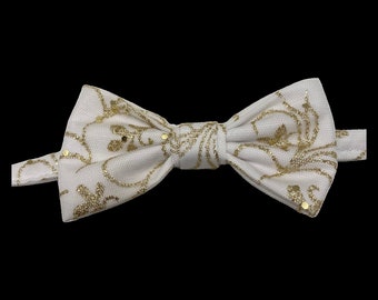 Holiday shimmer, pet bow tie, white with glittery gold detail.