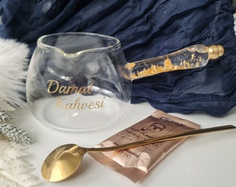 Cezve for the groom's mocha in gold with a pack of mocha and a spoon