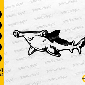 May include: A black and white hammerhead shark illustration. The shark is in profile, with its distinctive hammer-shaped head and a curved body. The image includes the text "SVG, DXF, PNG, EPS, AI" and "INSTANT DOWNLOAD".