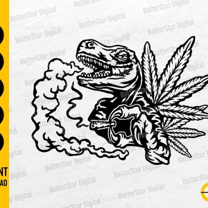 May include: A black and white graphic featuring a T-Rex exhaling smoke, a cannabis leaf, and a smoking device. The image includes the words "INSTANT DOWNLOAD" and file type icons: SVG, DXF, PNG, EPS, and AI.