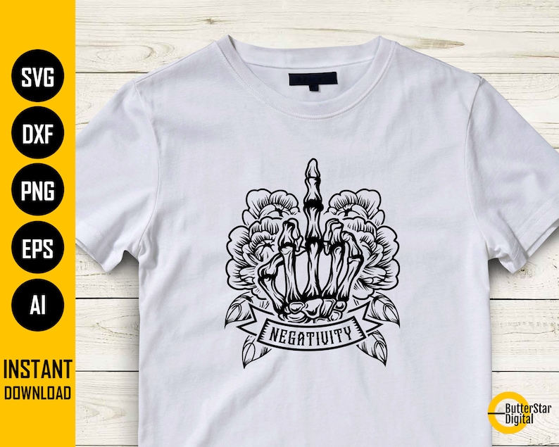 May include: White t-shirt featuring a black graphic of a skeletal hand giving the middle finger, surrounded by floral elements. The word "NEGATIVITY" is displayed on a banner below the hand. The shirt also has the words "SVG, DXF, PNG, EPS, AI" and "INSTANT DOWNLOAD" on the left side.