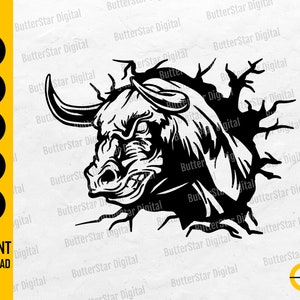 May include: Black and white digital illustration of an angry bull bursting through a wall. The image includes the text "SVG, DXF, PNG, EPS, AI" and "INSTANT DOWNLOAD". The bull has large horns and an aggressive expression.