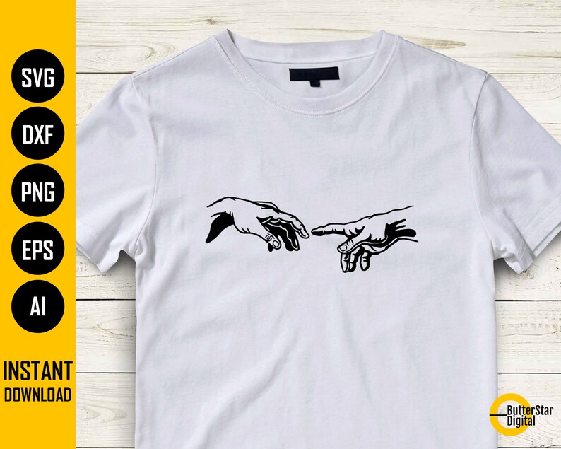 May include: White t-shirt featuring a black graphic of two hands nearly touching, a design inspired by the Sistine Chapel. The shirt also has the words "SVG, DXF, PNG, EPS, AI" and "INSTANT DOWNLOAD" in a vertical column on the left side.