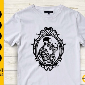 May include: White t-shirt with a black graphic of two skeletons in an embrace, framed within an oval border. The shirt also displays the text "INSTANT DOWNLOAD" and file type icons. This is a digital download design.