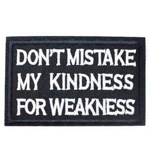 May include: Black embroidered patch with white text that reads "Don't mistake my kindness for weakness."