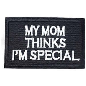 May include: Black embroidered patch with white text that reads "My Mom Thinks I'm Special".
