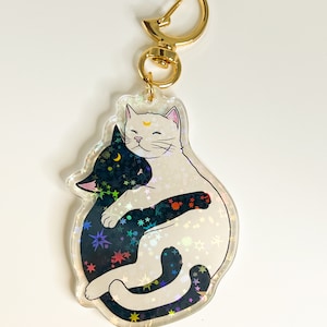 Hugging moon cats holographic keychain