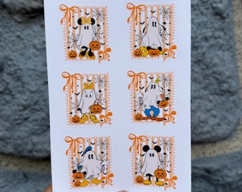 May include: A white sticker sheet titled 010 Sensational 6 Halloween featuring six rectangular designs with orange striped backgrounds, spiderwebs, and bows. Each design shows a cartoon ghost character wearing different accessories and holding pumpkins.
