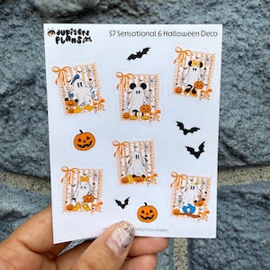 May include: A sticker sheet titled S7 Sensational 6 Halloween Deco featuring six rectangular frames with orange stripes and spiderwebs, each containing a ghost character in a costume, plus three black bat silhouettes and two orange jack-o'-lanterns.