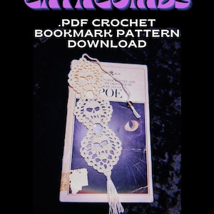 May include: A cream-coloured, crocheted bookmark with a skull design rests on a vintage book. The bookmark has a tassel and is advertised as a PDF crochet pattern download. The text "CATACOMBS" and "BLESTCHAINS" are also visible.