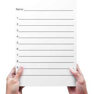 May include: A blank white sheet of paper with lines for writing. The paper is held by two hands.