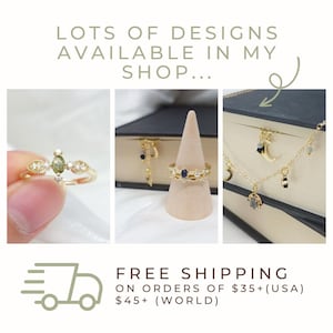 May include: Image showcasing various gold-toned jewelry pieces. Featured are a ring with a central green stone, a ring with blue stones, earrings, and a necklace with celestial charms. Text reads "LOTS OF DESIGNS AVAILABLE IN MY SHOP..."