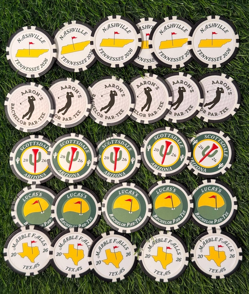 May include: A collection of twenty-five round poker chips arranged in five rows. The chips feature various designs including Nashville Tennessee 2026, Aaron's Bachelor Par-Tee, Scottsdale Arizona 2026, Lucas's Bachelor Par-Tee, and Marble Falls Texas 26.